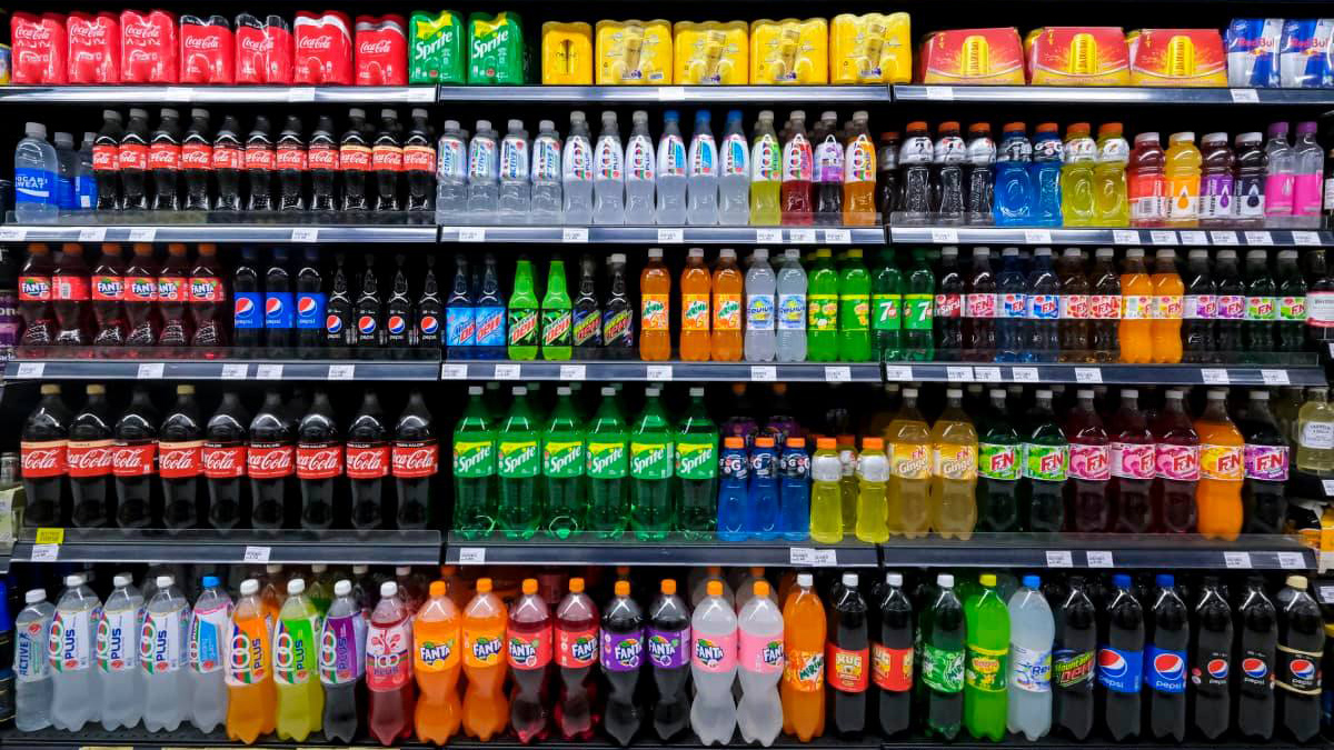 KUALA LUMPUR, MALAYSIA - MAY 04, 2020: Variety of energy drinks, soda, soft drinks, with various brands product in bottles and cans on the shelves in a grocery store supermarket. Beverages industry.